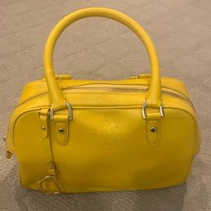 Ralph Lauren yellow purse with a handle.
